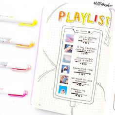 an open notebook with various pens and photos on the page, next to it is a clipboard that says playlist