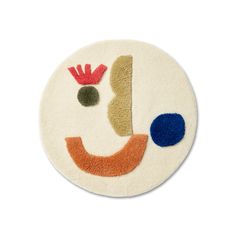 a round rug with an image of a clown's face on the front and side