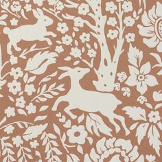 a brown and white wallpaper with flowers and deers on the side, in front of a tree