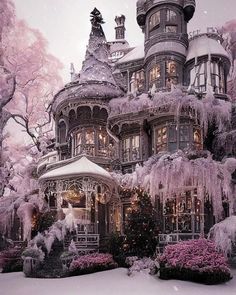 a large victorian style house covered in snow