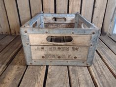 an old wooden crate sitting on top of a wooden floor