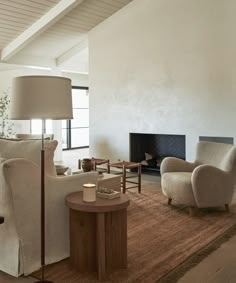 a living room filled with furniture and a fire place