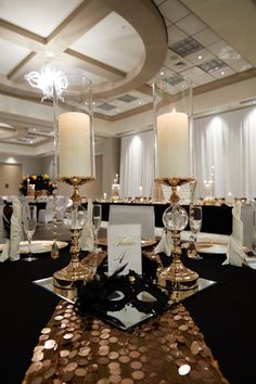 the table is set up with candles and place settings for guests to sit down at