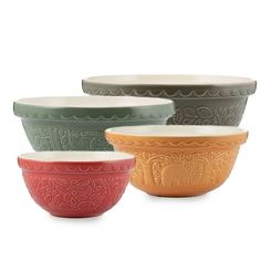 four bowls with elephants on them in different colors and designs, one is green, the other is red