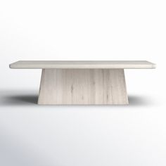 a white bench sitting on top of a wooden table