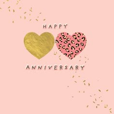 two hearts with the words happy anniversary in gold and pink on a light pink background