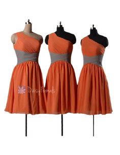 three bridesmaid dresses on mannequins, one in orange and the other in grey