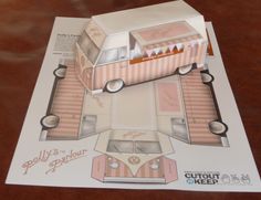 a paper model of a vw camper van with pink and white stripes on it