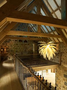 a loft with stone walls and wooden beams