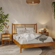 a bed sitting in a bedroom next to two tables with lamps on top of them