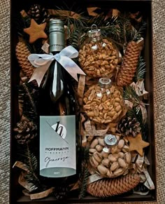 a bottle of wine and nuts in a box