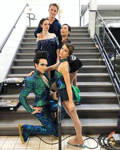 the dancers are posing for a photo on the stairs