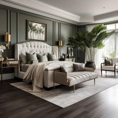 an elegant bedroom with green walls and white furniture, including a large bed in the center