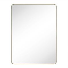 a square mirror with a gold frame on the bottom, and an empty white background