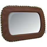 the mirror is brown and has spikes on it's sides, as well as a white background