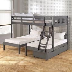 a bunk bed with a pull out trundle and mattresses on the bottom