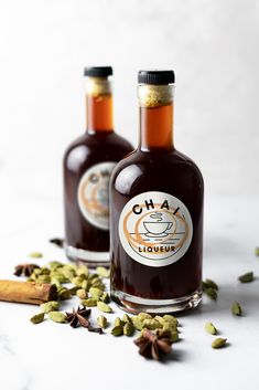 two bottles of chai sitting on top of a table