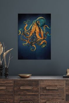 an octopus painting hanging on the wall above a dresser