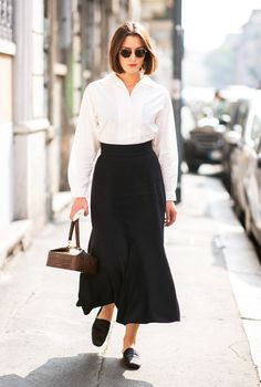 Expensive outfit ideas: white shirt and black skirt White And Black Office Outfit, Elegant Tailored Black Skirt, Chic Black Belted Pleated Skirt, Outfit Ideas White Shirt, Expensive Outfit Ideas, Black Skirt Old Money Outfit, Chic Black Silk Skirt, Chic Black A-line Pleated Skirt, Minimalist Work Outfit