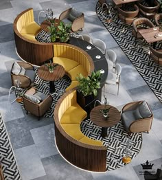 an overhead view of a restaurant with tables and chairs, couches and potted plants