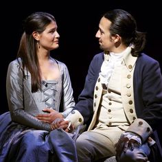 a man and woman sitting next to each other