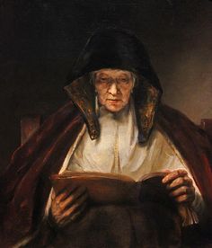 an old woman reading a book in a dark room