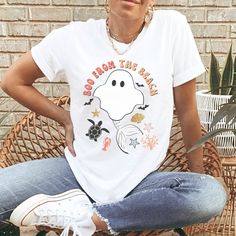 This Boo Halloween Shirt is a cute beach Halloween tee, great for a coastal Halloween.  Wear this retro fall shirt to a Halloween party, or wear throughout the Autumn season. This unisex tee fits like a well-loved favorite. Super soft cotton and excellent quality print makes this one to fall in love with it over and over again. 🎃 Shirt color white is 100% soft cotton 🎃 Shirt color heather ice blue is a soft cotton blend - 52% cotton, 48% poly 🎃 Shirt color athletic heather grey is 90% soft co Letter Print Tops For Fall Vacation, Letter Print Tops For Vacation In Fall, Short Sleeve T-shirt For Vacation In Fall, Fall Crew Neck T-shirt For Vacation, Fall Vacation T-shirt With Short Sleeves, Casual Beach T-shirt For Fall, Fall Vacation Crew Neck T-shirt, Fall Vacation Short Sleeve T-shirt, Casual Fall Beach T-shirt