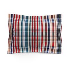 a red, white and blue plaid pillow on a white background