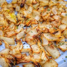 an air fryer onions on a blue plate