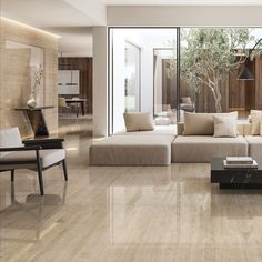 a modern living room with wood paneling and glass doors leading to an outdoor patio