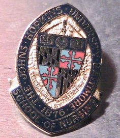 a badge is shown on a table with the words, university of southern florida seal