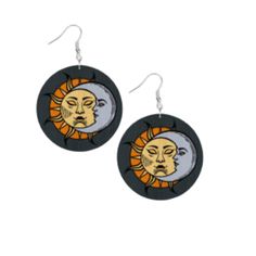 the sun and moon earrings are made out of black wood, with an orange design on it