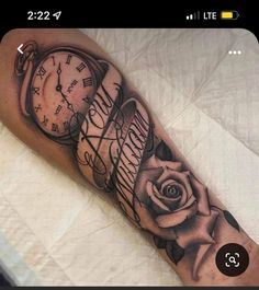 a black and white photo of a clock with roses on the arm that says happy valentine's day