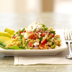 a white plate topped with vegetables and rice