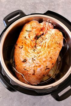 a cooked chicken in an air fryer