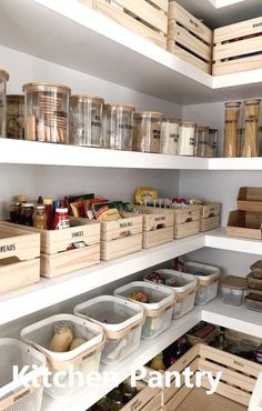 an organized pantry with wooden bins and baskets on the bottom shelf, full of food