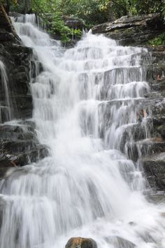 a waterfall with lots of water running down it