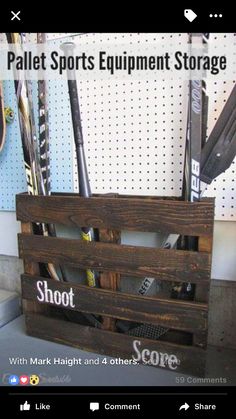 a pallet sports equipment storage box with baseball bats in it and the words shoot score written on it