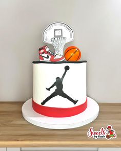 a birthday cake with a basketball and hoop on top