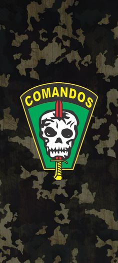 a camo background with the words comandaos on it and a skull in the center