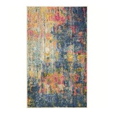 an area rug with multicolored paint on it