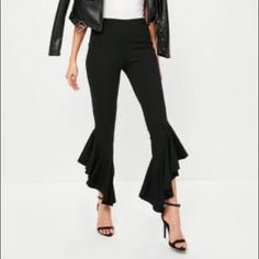 Misguided Frill Pants Black Trousers For Spring, Edgy Flare Bottoms For Party, Edgy Flare Pants For Party, Black Flare Dress Pants For Evening, Edgy Wide Leg Bottoms For Going Out, Casual Black Pants For Party, Black Flare Bottoms For Workwear, Black Flared Bottoms For Workwear, Edgy Black Bottoms For Spring