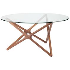 an oval glass table with wooden legs