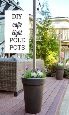 a sign that says diy cafe light pole pots with flowers in front of it