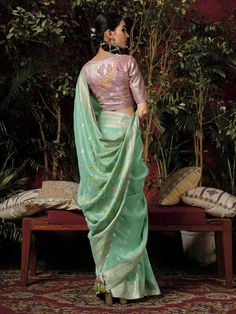 Introducing our exquisite "pretty teal green zari weaving silk festival wear saree with blouse" - the perfect outfit to make a statement at any festive occasion. This stunning teal-green silk saree features intricate sequin and embroidered work that adds a touch of elegance and charm to your look. Paired with a pink silk blouse with zari weaving work, this saree set is sure to turn heads wherever you go.
The 5.50-meter saree and unstitched blouse material allow for customization and a perfect fi Green Semi-stitched Pre-draped Saree With Meenakari, Festive Green Pre-draped Saree With Zari Weaving, Green Bollywood Pre-draped Saree With Meenakari, Green Paithani Silk Pre-draped Saree With Self Design, Green Pre-draped Saree With Zari Weaving For Diwali, Bollywood Banarasi Silk Blouse With Meenakari, Festive Green Paithani Silk Pre-draped Saree, Festive Banarasi Silk Blouse With Meenakari Details, Festive Banarasi Silk Meenakari Blouse