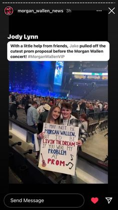 a man and woman holding a sign in front of an audience