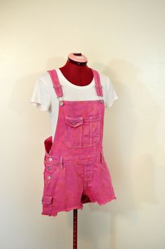 #220821 I have been dying denim regularly - I just started dying other items like these overalls.  They have been a big hit! ABOUT OVERALLS: Overalls are loose fitting. The waist measurement is about 1-2 inches larger than what you would normally wear.  Adult Small 32-34" waist.  Medium  34-36" waist,  large 36-38 waist and  XL are 38-42 waist.  DETAILS: NEW Denim Overalls "No Boundaries" Brand 99% Cotton/1%Spandex Mock Fly -These have a sunflower printed on the denim and it faintly shows throug Orange Overalls, Disneyworld Outfits, Little Top Big Pants, Pink Hairband, Denim Shortalls, Jeans Rosa, Pink Overalls, White Sleeveless Shirt, Ballet Tights