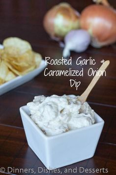 roasted garlic and caramelized onion dip in a white bowl with chips on the side