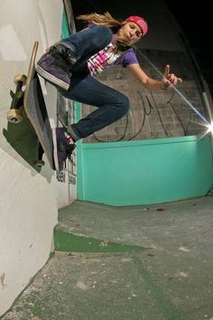 a skateboarder is doing a trick in the air with his skateboard and lights on