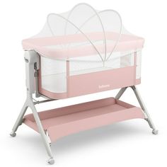 a pink baby crib with a white canopy